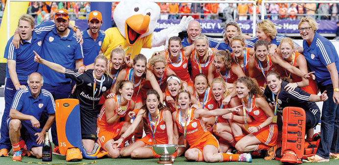 The Netherlands players pose after defeating Australia to win the World Cup in the womenu2019s tournament of the Hockey World Cup in The Hague yesterday. 