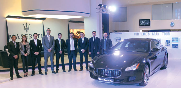 Mohamed Kandeel with colleagues and guests at the Maserati  showroom.