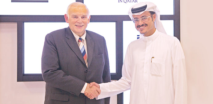 Abdulaziz al-Khater and Everette E Dennis after signing a partnership pact. 