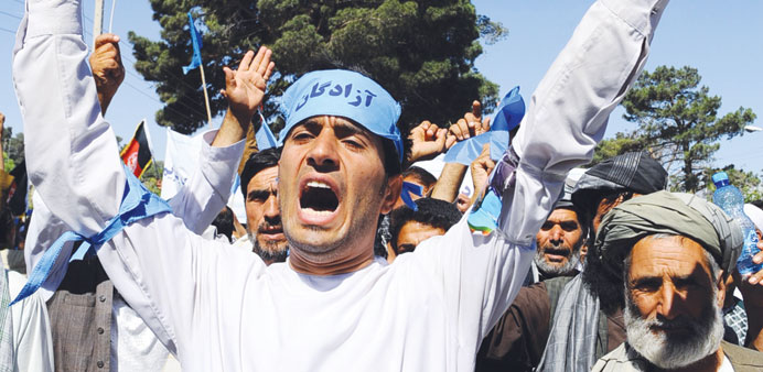 Afghan demonstrators shout slogans in support of presidential candidate Abdullah Abdullah in Herat yesterday.