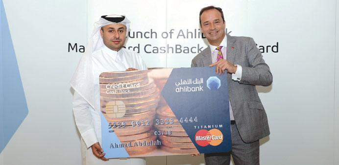 Ahlibanku2019s Hassan al-Frangi and Andrew McKechnie with the MasterCard CashBack credit card.