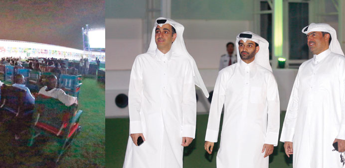Visitors at the fan zone. Right: Al-Thawadi with other officials at the venue.