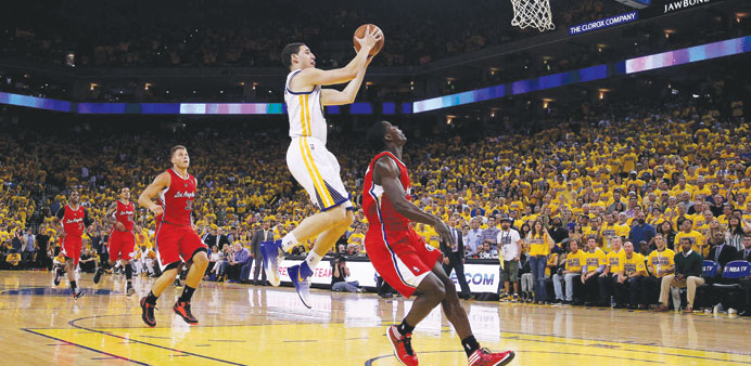 Klay Thompson of the Golden State Warriors goes up for a shot against the Los Angeles Clippers in Game Six of the Western Conference Quarter-finals du