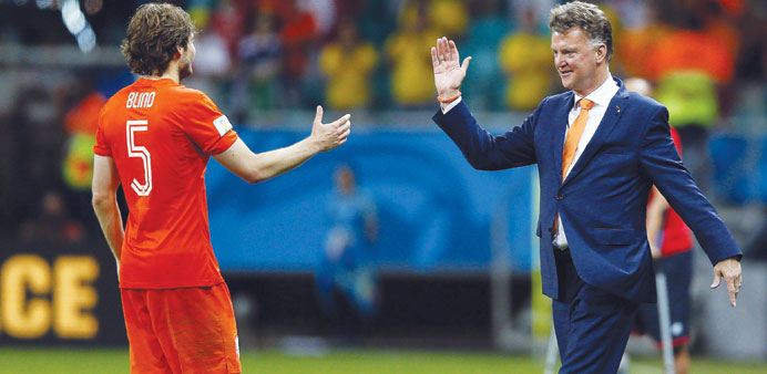  WELCOME TO UNITED: A file picture dated July 5 shows Daley Blind of the Netherlands celebrating with Dutch head coach Louis van Gaal after the World 