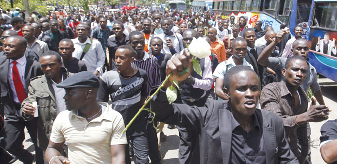 Kenyan university students participate in a demonstration at the Garissa University College campus, demanding better security.