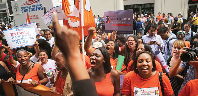Employees protest outside of a Wendyu2019s and Burger King restaurants in New York City.