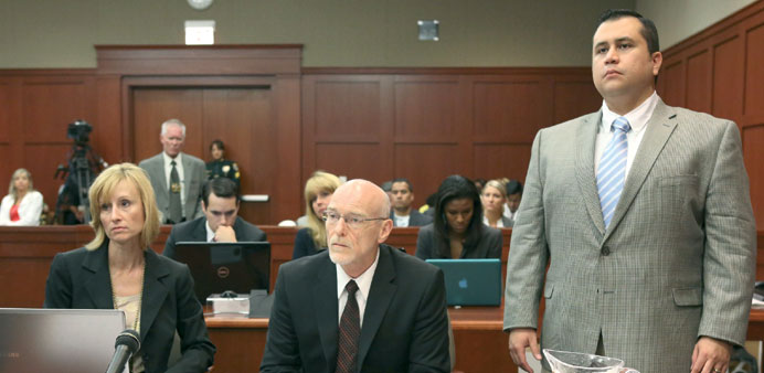 Zimmerman stands for instruction from Judge Debra Nelson alongside defence attorney Don West.