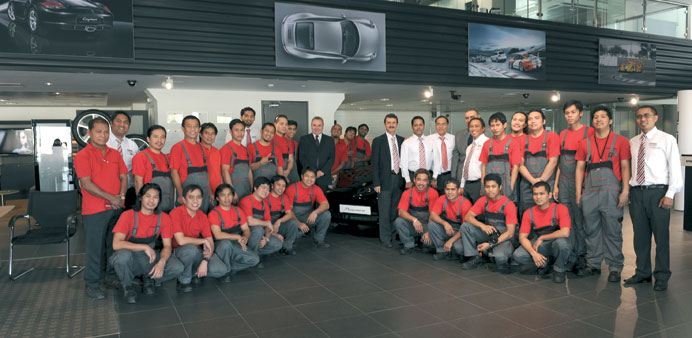 The Porsche team that completed the training along with senior officials.