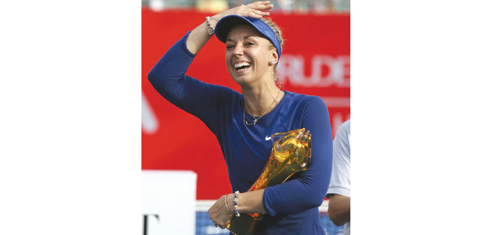 Germanyu2019s Sabine Lisicki is all smiles with her Hong Kong Open trophy. She beat Czech Karolina Pliskova in the final. (Reuters)