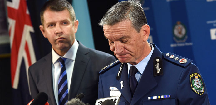 New South Wales police commissioner Andrew Scipione (R) and state Premier Mike Baird speak to the media in Sydney