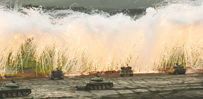 Japanu2019s Ground Self Defence Forceu2019s Type 10 tanks fire their cannons during a firing drill at Higashi-Fuji manoeuvre training field in Gotenba, Shizuo