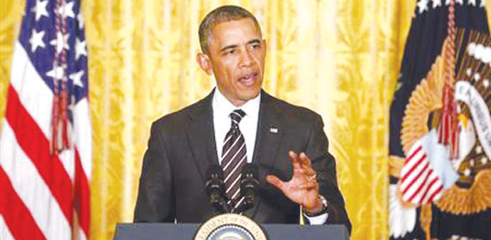 US President Barack Obama delivers remarks at a reception with US mayors at the White House in Washington.