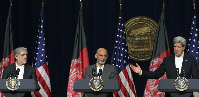 (L-R) Afghanistan Chief Executive Abdullah Abdullah, Afghanistan President Ashraf Ghani and US Secretary of State John Kerry