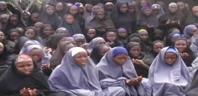 A screengrab taken on May 12, 2014, from a Boko Haram video obtained by AFP shows girls, wearing the full-length hijab and praying in an undisclosed r
