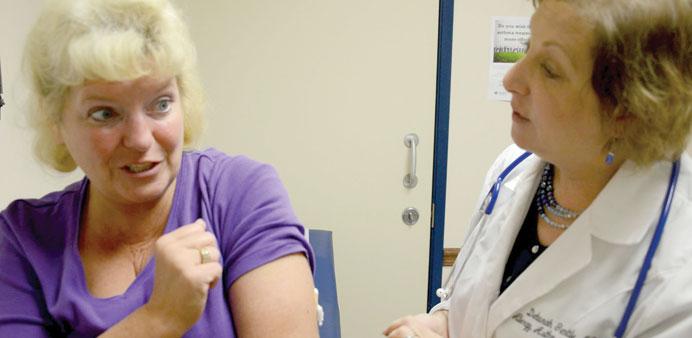 SENSITIVE: Elizabeth Sandhagen (left) is seen with Dr Deborah Gentile, who injected her with Xolair in Pittsburgh. 
