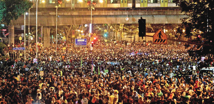 This picture taken late on Tuesday shows Malaysian protesters gathered in front of Independence Square during a protest against the rising cost of liv