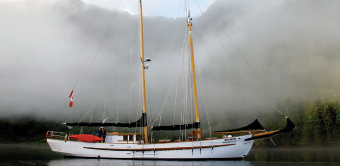   Mist gathers around the Maple Leaf, a schooner that cruises off the western coast of Canada.