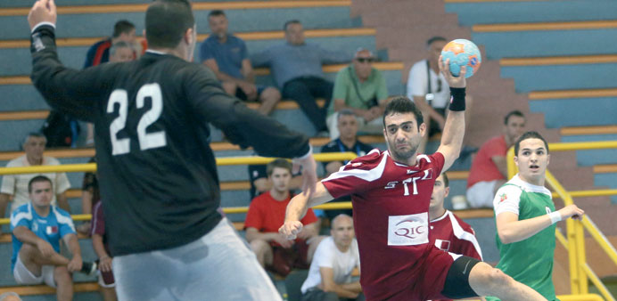A Qatar player shoots during his teamu2019s match against Algeria in the IHF Junior World Championship yesterday.