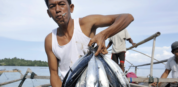  Many Bomba residents like this man rely on fishing to make a living.