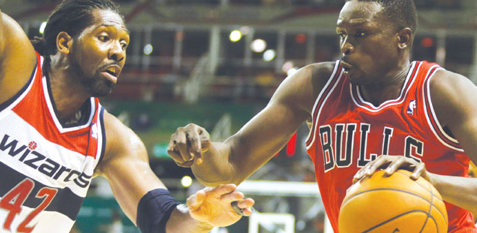 Chicago Bullsu2019 Luol Deng (right) challenges Washington Wizardsu2019 Nene during an NBA Global Games Rio 2013 basketball game in Rio de Janeiro on Saturday