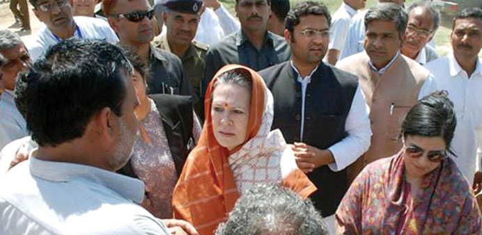 Congress president Sonia Gandhi interacts with farmers during her visit to Rewari in Haryana yesterday.