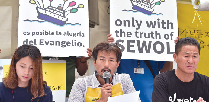 Relatives of the Sewol ferry disaster hold a press conference urging Pope Francis to support their campaign at Gwanghwamun Square in central Seoul yes