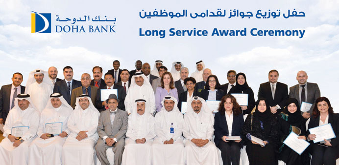 Doha Bank officials and recipients of the u201cLong-Service Awardsu201d during the awarding ceremony.