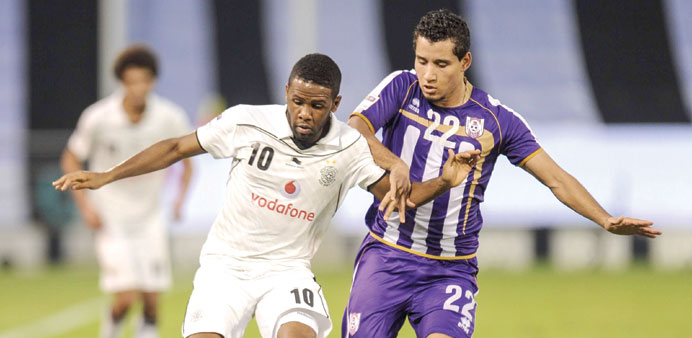 Al Sadd's Khalfan Ibrahim (L) and Muaither's  Mohamed Attiya battle for the ball during their QSL match yesterday.