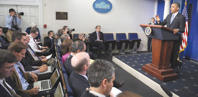 Obama answers questions from reporters after making statement on the Affordable Care Act (ACA) in the Brady Press Room at the White House in Washingto