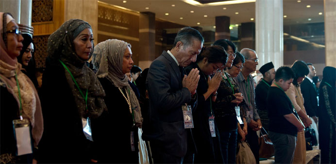 Family members and next-of-kin of Malaysia Airlines flight MH17 victims offer prayers 