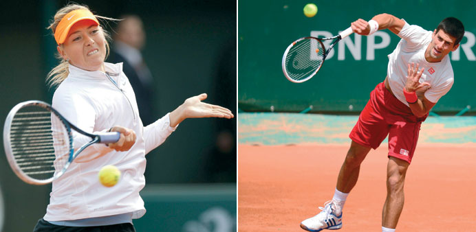 Russia's Maria Sharapova (left) and Novak Djokovic of Serbia during a practice session on the eve of the French Open tennis tournament, in Paris yeste