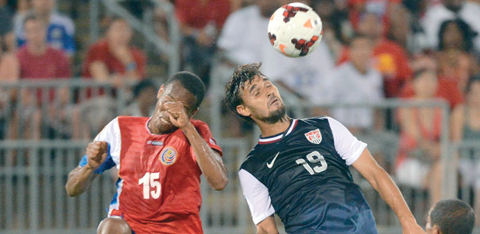 Chris Wondolowski (right) of the US and Junior Diaz of Costa Rica vying for the ball during their 2013 CONCACAF Gold Cup match at Rentschler Field in 
