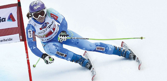 Sloveniau2019s Tina Maze speeds down the slope during womenu2019s World Cup downhill training session on the eve of the Alpine Skiing World Cup finals, in Len