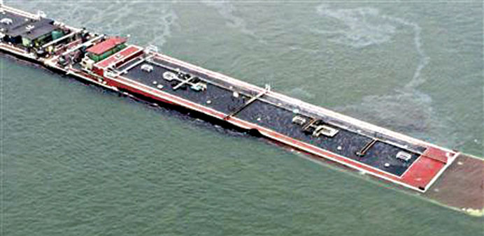 US Coast Guard photo shows barge loaded with marine fuel oil partially submerged in the Houston Ship Channel