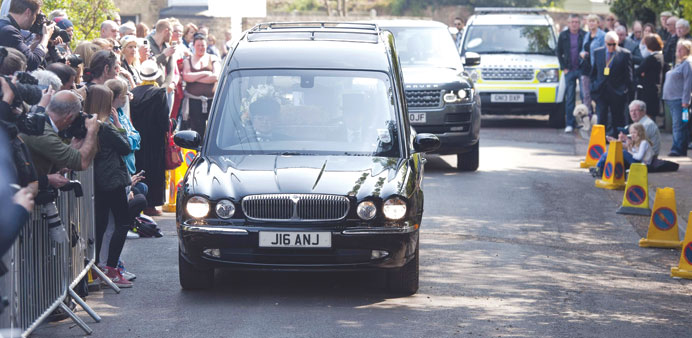 The hearse carrying the casket of Peaches Geldof drives into the Church of St Mary Magdalene and St Lawrence in Faversham, Kent, yesterday.
