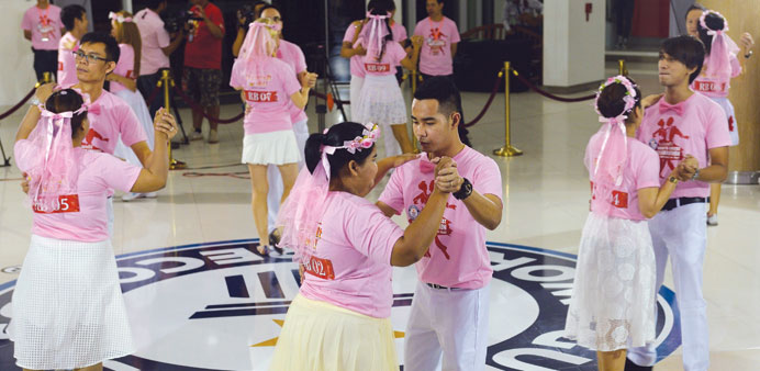 Couples take part in an event promoted as the worldu2019s longest dance marathon contest in the Thai city of Pattaya.