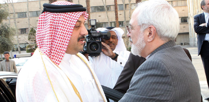 Qataru2019s Foreign Minister HE Dr Khalid bin Mohamed al-Attiyah is greeted by his Iranian counterpart Mohamed Javad Zarif on arrival in Tehran yesterday.