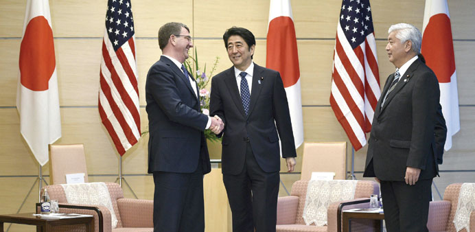 US secretary of defence Carter with Japanu2019s Prime Minister Shinzo Abe as Japanu2019s defence minister general Nakatani looks on at the start of their meet