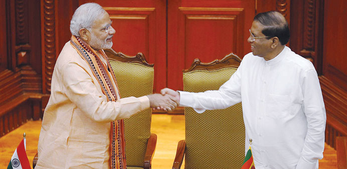 Indiau2019s Prime Minister Narendra Modi, left,  shaking hands with Sri Lankau2019s President Maithripala Sirisena at the Presidential Secretariat in Colombo 