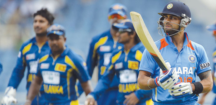 MUST-WIN GAME: Stand-in Indian skipper Virat Kohli (right) faces the tough task of motivating his side against the West Indies after Tuesdayu2019s heavy 1