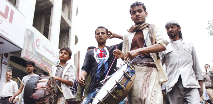 Yemeni supporters of the Saudi-led coalitionu2019s Operation Decisive Storm play drums during a demonstration in the southwestern city of Taez yesterday.