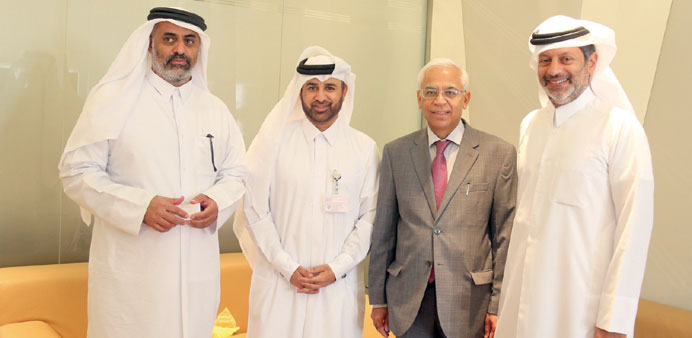 Dr Al-Sulaiti and other Katara officials with Arora.