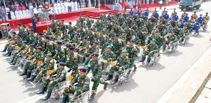  ARMED FORCES DAY: Disabled Sri Lankan soldiers take part in an Armed Forces Day parade in Matara, 160km south of Colombo.