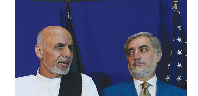 Afghan presidential candidates Ashraf Ghani (left) and Abdullah Abdullah.