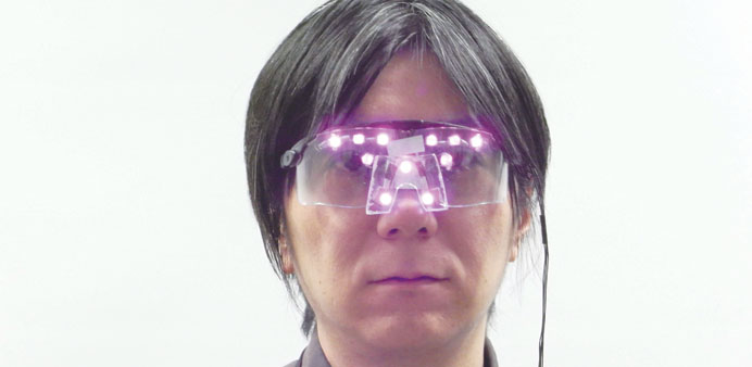 This handout picture taken by Japanu2019s National Institute of Informations associate professor Isao Echizen shows a man wearing the special u2018Privacy Vis