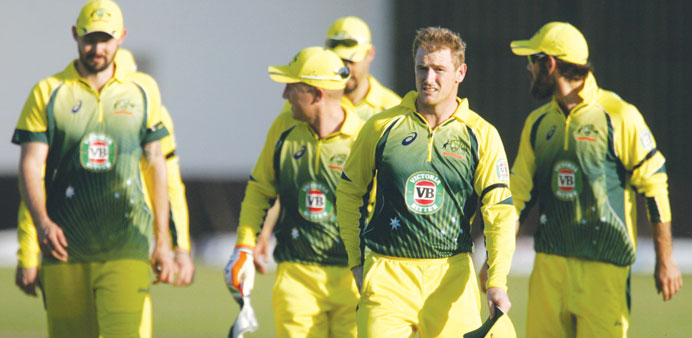 Australia captain George Bailey leads his team off the pitch after victory over Zimbabwe in the first match of the Tri-Nation ODI series in Harare on 