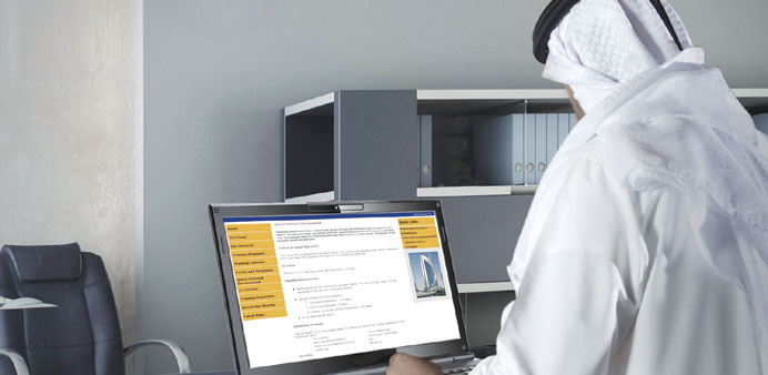 A staff member of Doha Bank browsing the new portal.