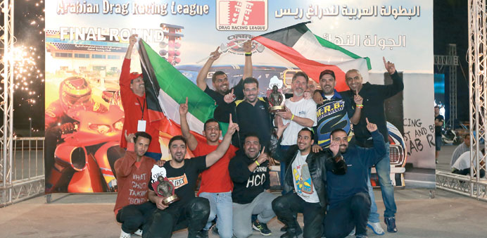 The winners at the Arab Drag Racing League pose with their trophies