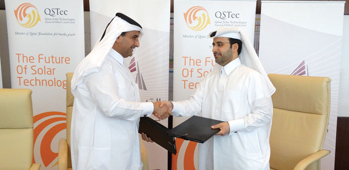 Qatar Solar Technologies  and Qatar Railways Company officials shaking hands after signing the MoU.