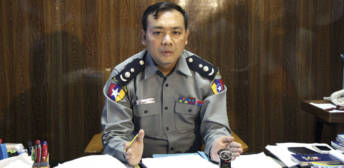 Chief Superintendent Zaw Min Oo talks to the media during a news conference about riots in Mandalay yesterday.